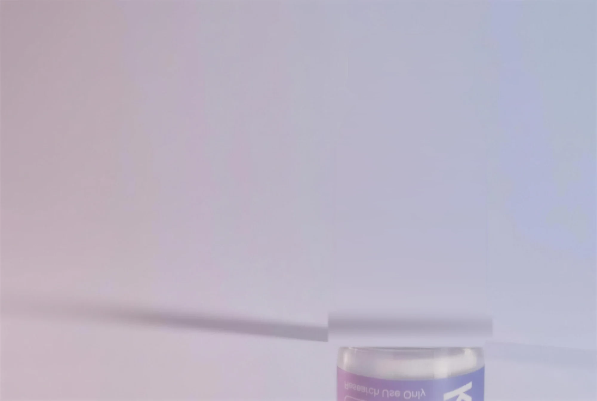Ipamorelin 10MG vial, photographed on a lacquer counter